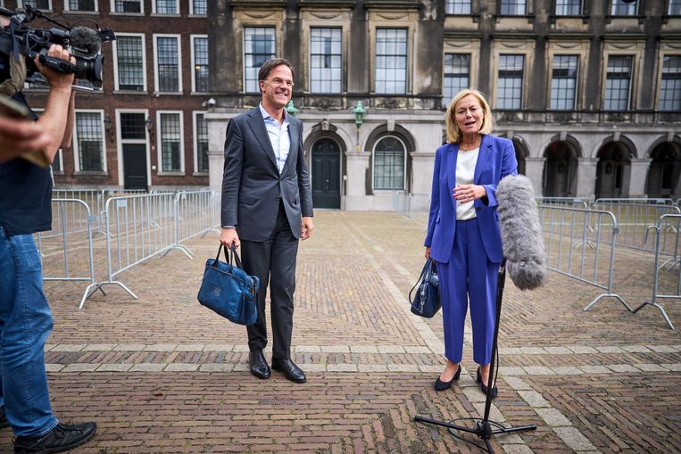 Mark Rutte and Sigrid Kaag walk out after a conversation with Detective Mariette Hammer about forming a government.  ANP . image